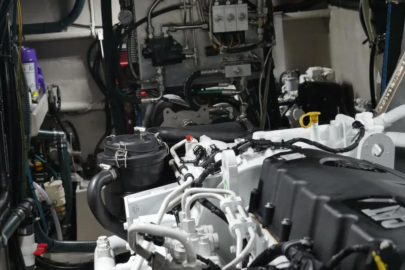 Alliance Yacht Photos Pics Engine room of 2022 Custom Freestyle Marine 32 boat, showcasing complex machinery and components.