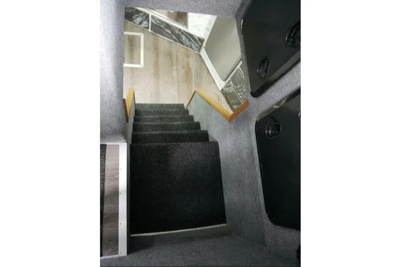 Alliance Yacht Photos Pics Interior stairs of 2022 Custom Freestyle Marine 32 boat, featuring carpeted steps.