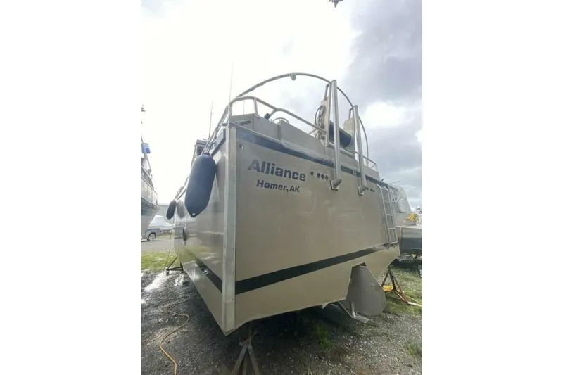 Alliance Yacht Photos Pics Custom Freestyle Marine 32 boat, 2022 model, docked in Homer, AK, under cloudy skies.