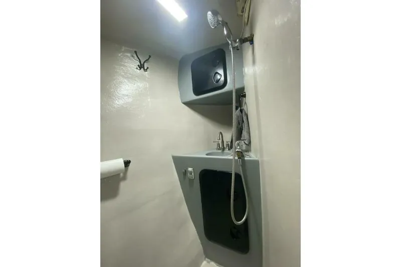 Alliance Yacht Photos Pics Compact bathroom in 2022 Custom Freestyle Marine 32 boat with shower and sink.