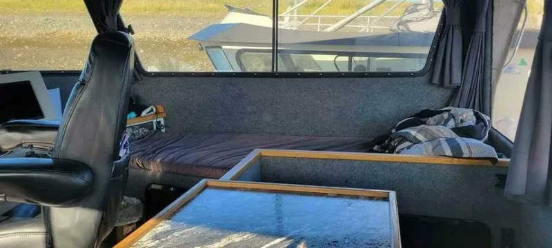 Alliance Yacht Photos Pics Interior of 2022 Custom Freestyle Marine 32 boat with seating and table.