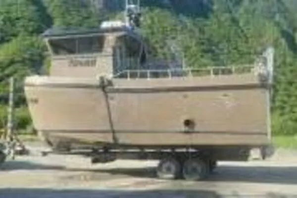 Alliance Yacht Photos Pics 2022 Custom Freestyle Marine 32 boat on trailer in a forested area.