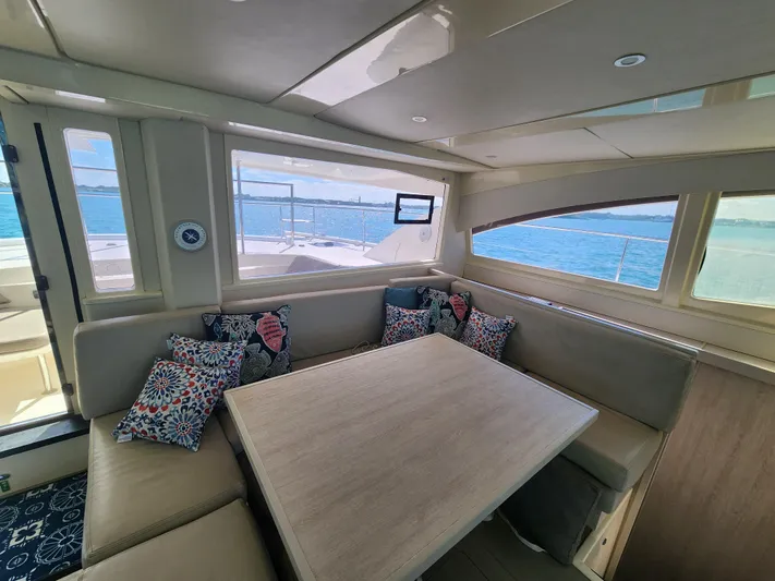 Salty Mitches Yacht Photos Pics Interior of 2016 Leopard 51 Powercat with cozy seating and ocean view.