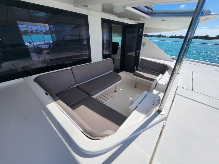 Salty Mitches Yacht Photos Pics 2016 Leopard 51 Powercat yacht with spacious outdoor seating area and ocean view.