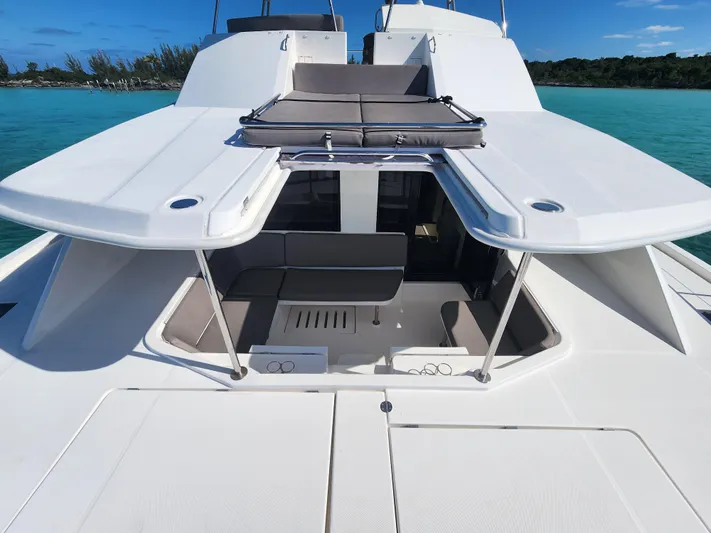 Salty Mitches Yacht Photos Pics 2016 Leopard 51 Powercat yacht with open deck, seating area, and ocean view.
