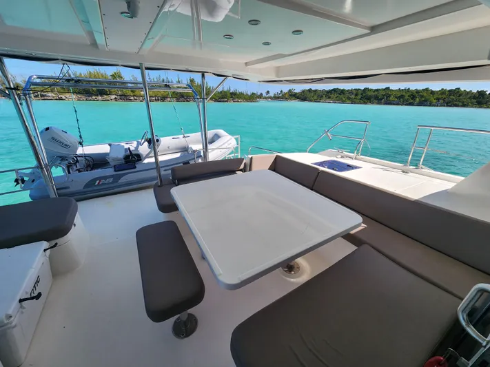 Salty Mitches Yacht Photos Pics Leopard 51 Powercat 2016 yacht interior with seating, table, and ocean view.