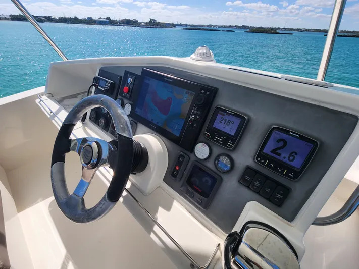 Salty Mitches Yacht Photos Pics Leopard 51 Powercat 2016 helm with navigation instruments and ocean view.