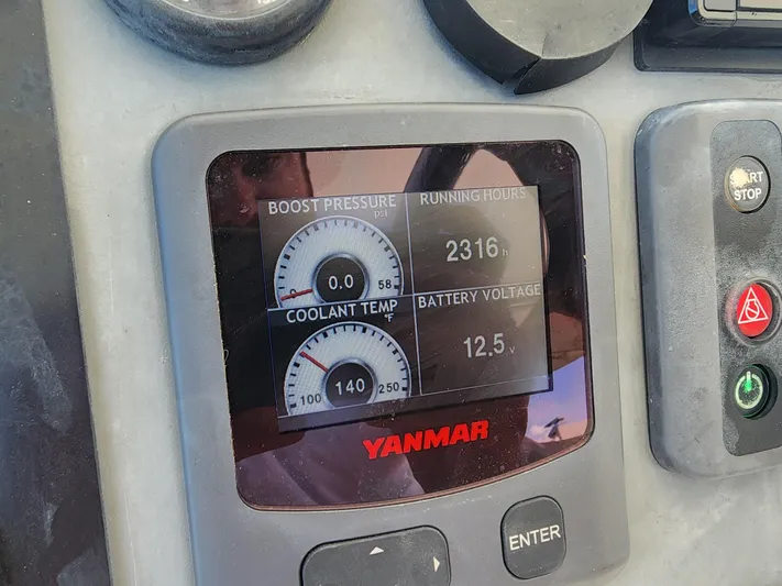 Salty Mitches Yacht Photos Pics Yanmar engine display on 2016 Leopard 51 Powercat showing boost pressure, running hours, coolant temp, battery voltage.