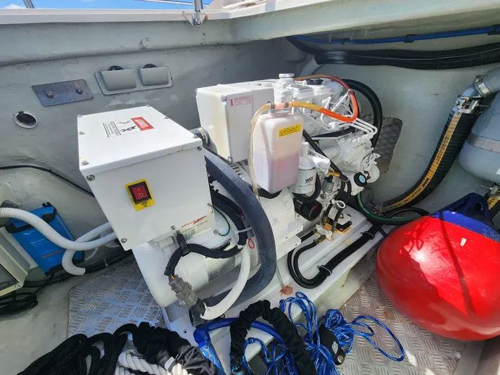 Salty Mitches Yacht Photos Pics Engine compartment of 2016 Leopard 51 Powercat with equipment and ropes.