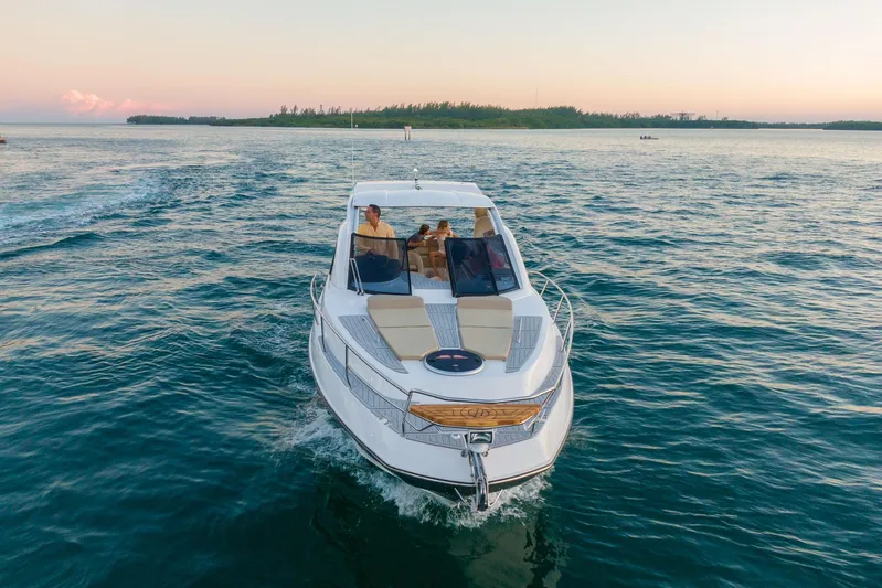  Yacht Photos Pics Luxury Hanover 375 yacht cruising on serene waters at sunset, 2026 model.