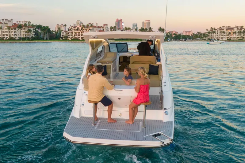  Yacht Photos Pics Luxury Hanover 375 yacht cruising with passengers, scenic waterfront view, 2026 model.