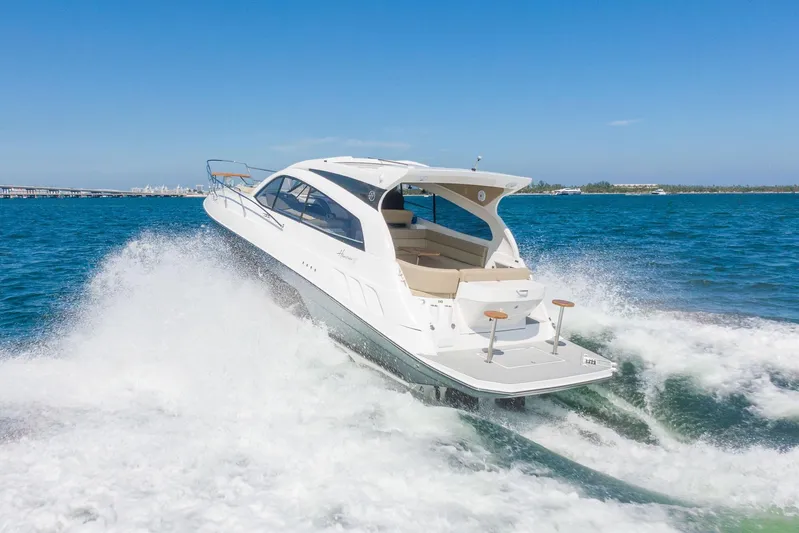  Yacht Photos Pics 2026 Hanover 375 yacht cruising on open water, creating waves under clear blue sky.