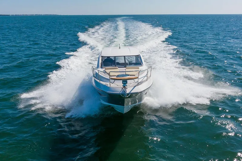  Yacht Photos Pics 2026 Hanover 375 yacht cruising on open sea, creating a dynamic water trail.