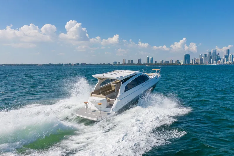  Yacht Photos Pics Luxury Hanover 375 yacht cruising near city skyline, 2026 model.