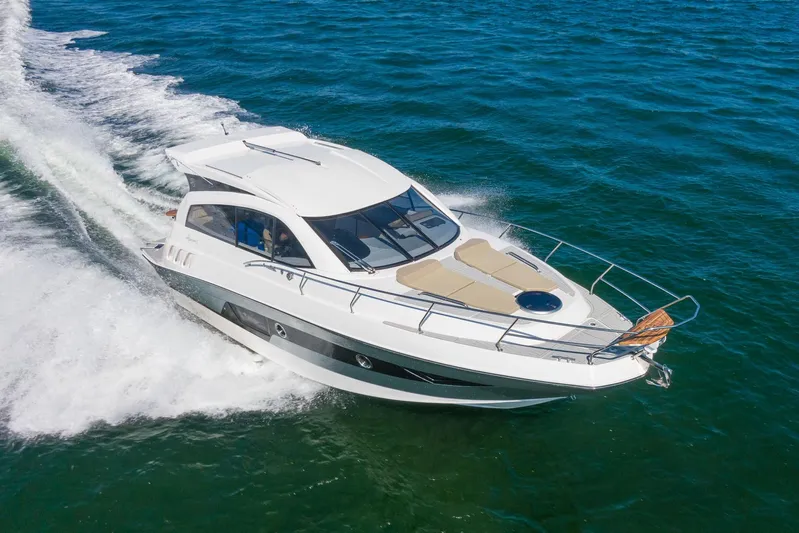  Yacht Photos Pics 2026 Hanover 375 yacht cruising on open water, showcasing sleek design and luxury features.