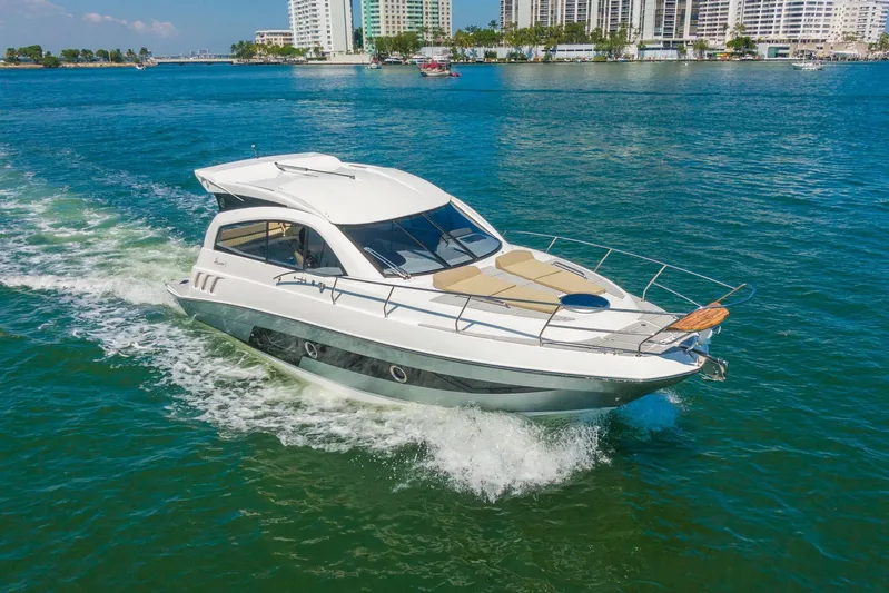  Yacht Photos Pics 2026 Hanover 375 yacht cruising on blue water near city skyline.