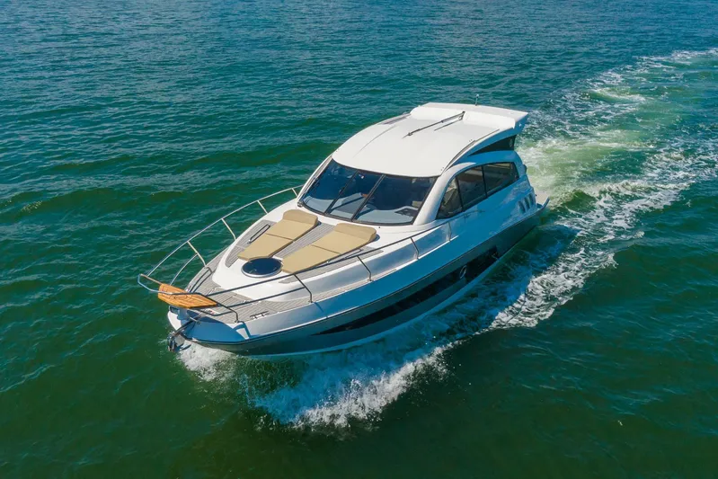  Yacht Photos Pics 2026 Hanover 375 yacht cruising on open water, showcasing sleek design and luxury features.