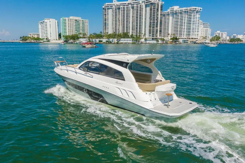  Yacht Photos Pics Luxury Hanover 375 yacht cruising near city skyline, 2026 model.