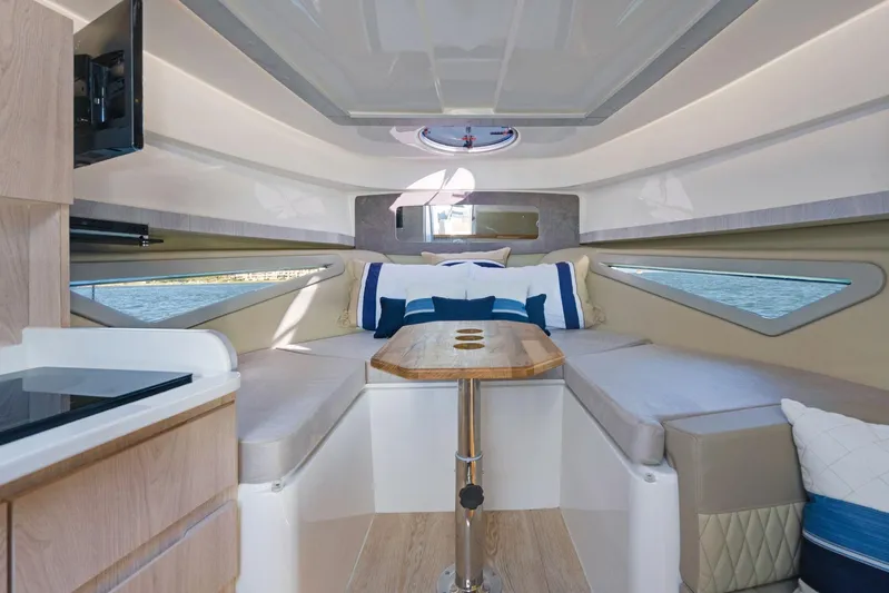 Yacht Photos Pics Luxurious interior of 2026 Hanover 375 yacht with cozy seating and elegant design.