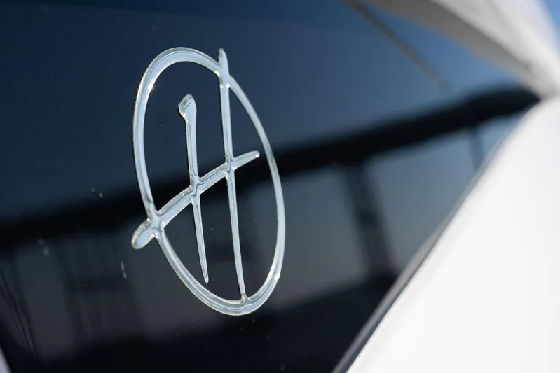  Yacht Photos Pics 2026 Hanover 375 logo on sleek black surface, close-up view.