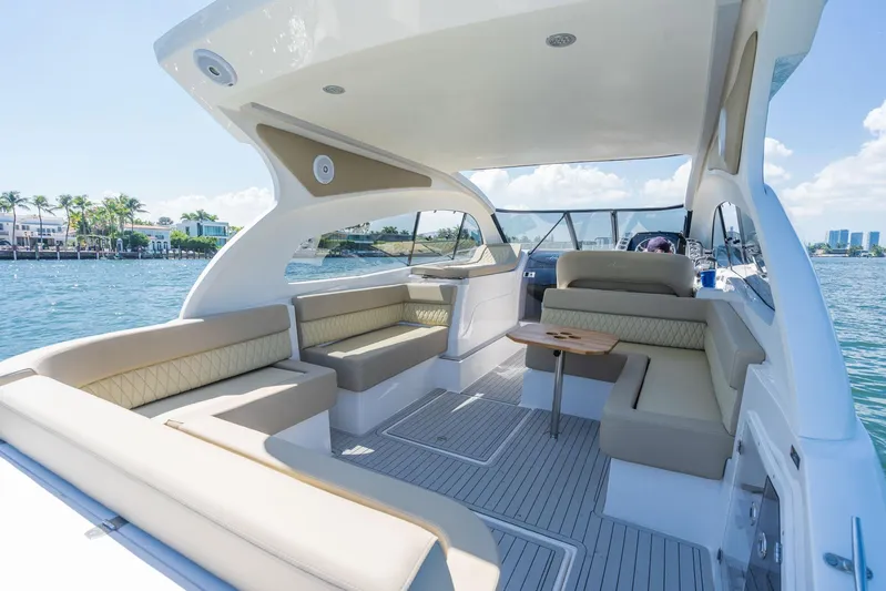  Yacht Photos Pics Luxurious 2026 Hanover 375 yacht interior with elegant seating and scenic waterfront view.