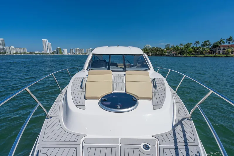  Yacht Photos Pics Luxury Hanover 375 yacht cruising on a sunny day, city skyline in background, 2026 model.