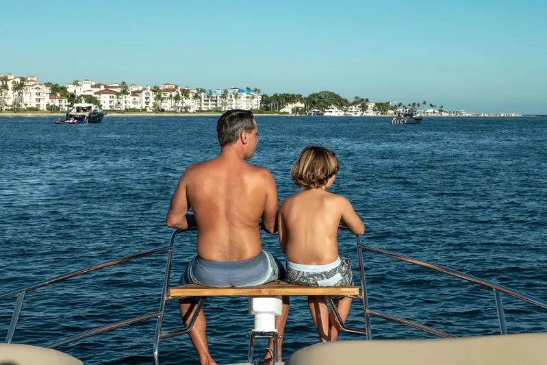  Yacht Photos Pics Father and son on Hanover 375 yacht, enjoying ocean view, 2026.