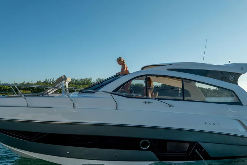  Yacht Photos Pics 2026 Hanover 375 yacht cruising on a sunny day with passengers on deck.