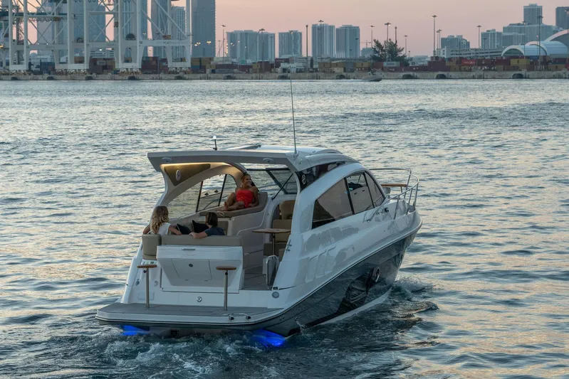  Yacht Photos Pics Luxury Hanover 375 yacht cruising near city skyline at sunset, 2026 model.