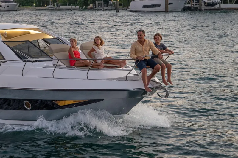  Yacht Photos Pics Family enjoying a ride on a 2026 Hanover 375 yacht in open water.