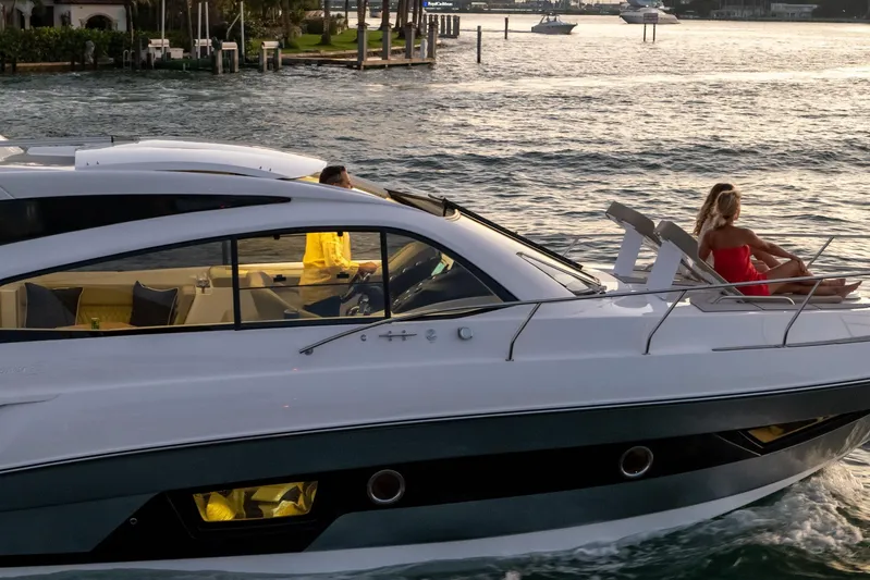  Yacht Photos Pics 2026 Hanover 375 yacht cruising with passengers enjoying the sunset on deck.