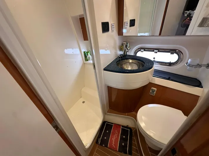 Maurizio Nesti Yacht Photos Pics Bathroom interior of 2007 Sealine F42/5 yacht with shower, sink, and toilet.