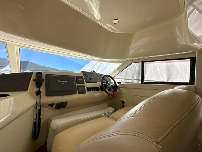Maurizio Nesti Yacht Photos Pics Interior of 2007 Sealine F42/5 yacht cockpit with steering wheel and navigation equipment.