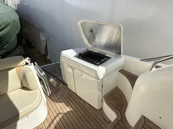 Maurizio Nesti Yacht Photos Pics 2007 Sealine F42/5 yacht deck with built-in grill and seating area.