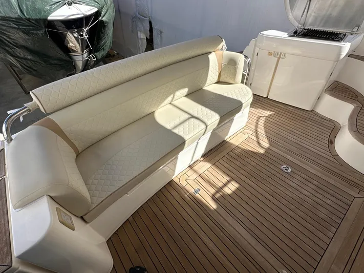 Maurizio Nesti Yacht Photos Pics 2007 Sealine F42/5 yacht interior with beige seating and wooden flooring.