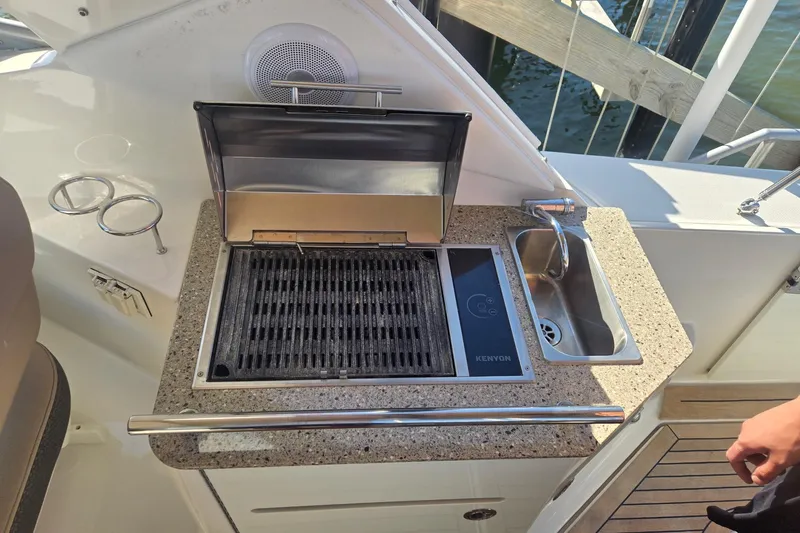 The Braciole Yacht Photos Pics Outdoor kitchen on 2017 Sea Ray 310 Sundancer yacht with grill and sink.