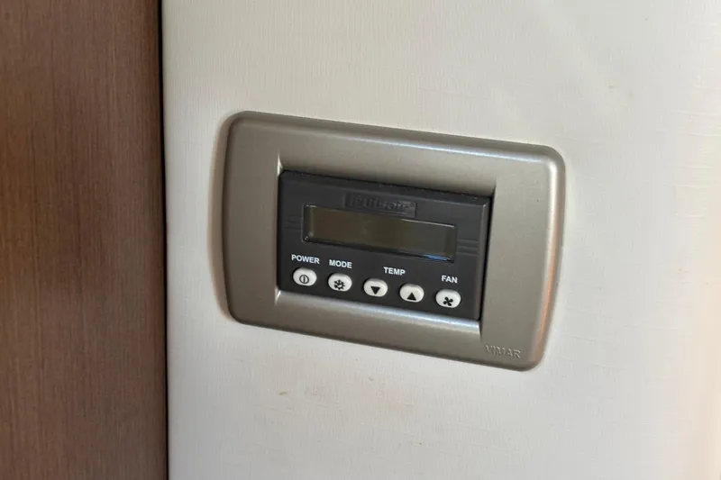 The Braciole Yacht Photos Pics Control panel on 2017 Sea Ray 310 Sundancer boat, featuring power, mode, temperature, and fan settings.