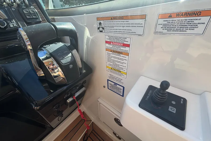 The Braciole Yacht Photos Pics Control panel of 2017 Sea Ray 310 Sundancer with throttle and joystick.