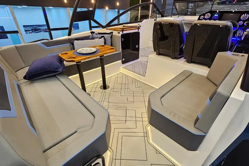  Yacht Photos Pics Luxurious interior of 2026 Hanover 327 boat with modern seating and elegant table setup.