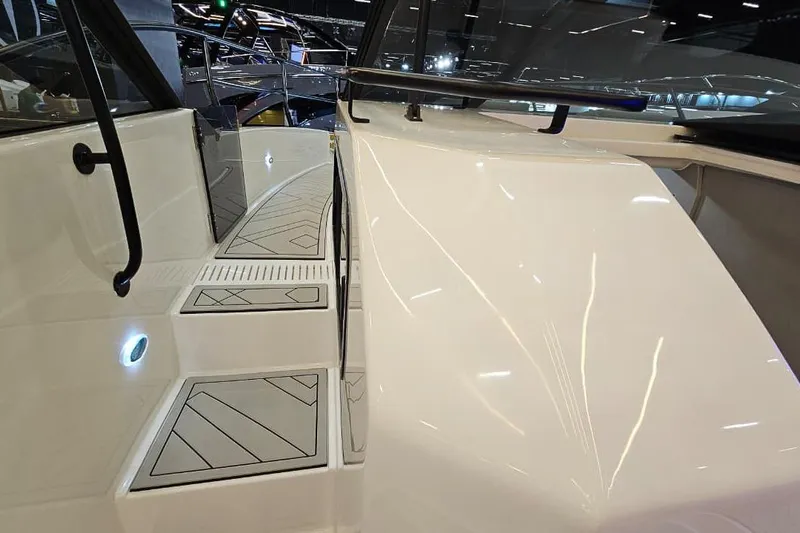  Yacht Photos Pics 2026 Hanover 327 boat interior with sleek white design and modern features.