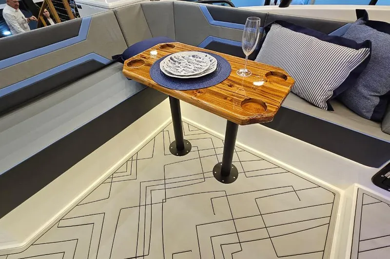  Yacht Photos Pics Luxurious Hanover 327 yacht interior with elegant seating and wooden table, 2026 model.
