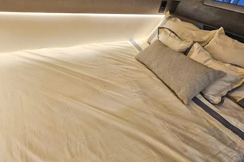  Yacht Photos Pics Luxurious bed with elegant pillows in a Hanover 327, 2026 model.