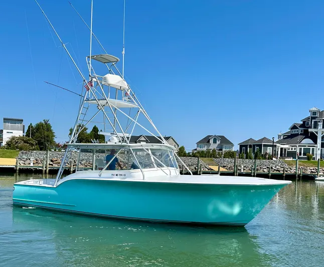 Wire Nut Yacht Photos Pics 2002 Custom Carolina 40 Express Sportfisherman in marina, clear sky, waterfront homes.