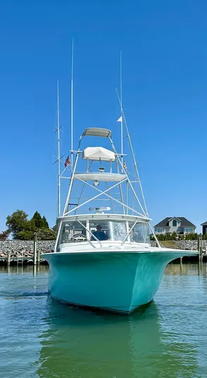 Wire Nut Yacht Photos Pics Custom Carolina 40 Express Sportfisherman, 2002 model, docked in a serene marina setting.
