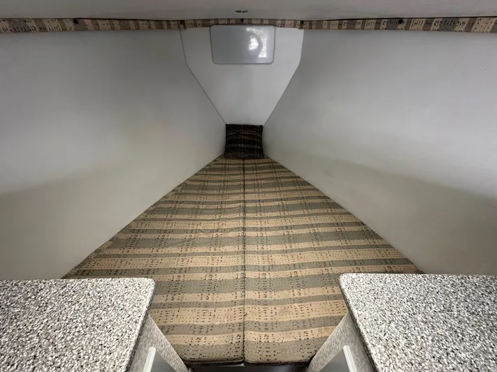 Wire Nut Yacht Photos Pics Interior cabin of 2002 Custom Carolina 40 Express Sportfisherman with patterned bedding.