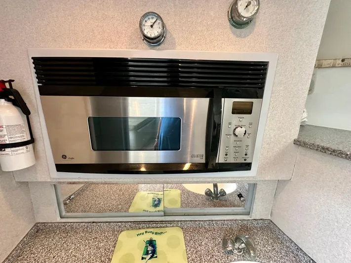 Wire Nut Yacht Photos Pics Microwave in 2002 Custom Carolina 40 Express Sportfisherman kitchen with countertop and fire extinguisher.
