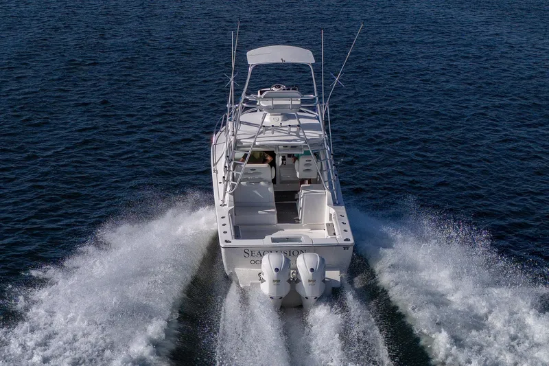 Seaclusion Yacht Photos Pics 2018 Albemarle 290 Express Fisherman cruising on open water, rear view.