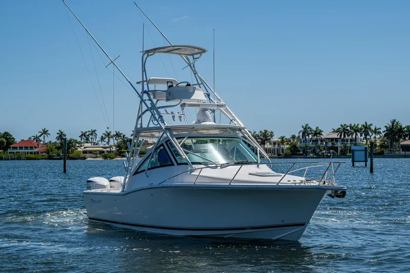 Seaclusion Yacht Photos Pics 2018 Albemarle 290 Express Fisherman boat cruising on a sunny day near palm trees.