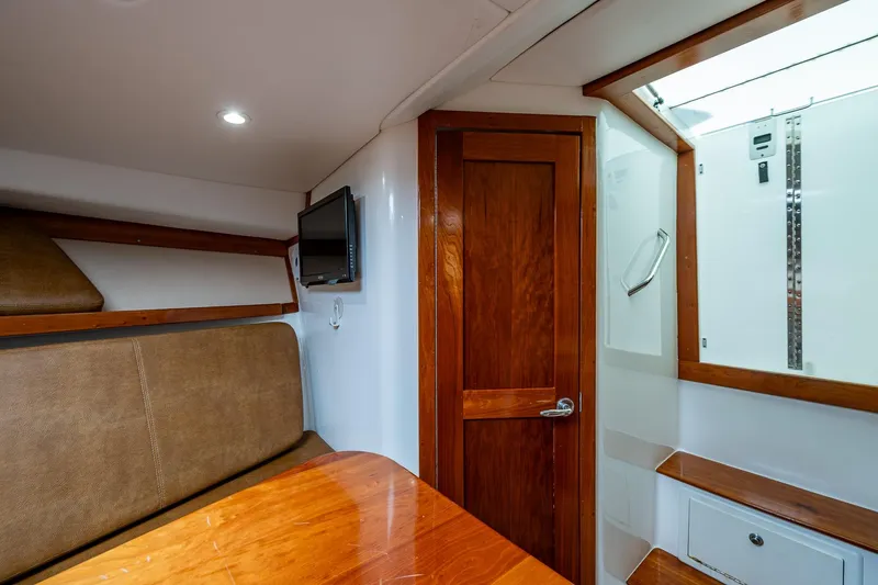 Seaclusion Yacht Photos Pics Interior of 2018 Albemarle 290 Express Fisherman with wood accents and seating area.