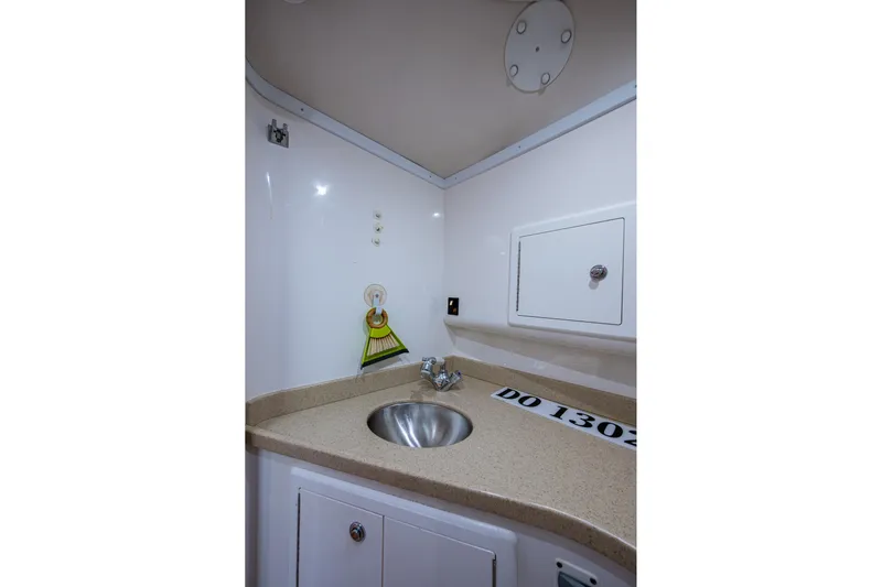 Seaclusion Yacht Photos Pics Interior of 2018 Albemarle 290 Express Fisherman with sink and storage compartment.